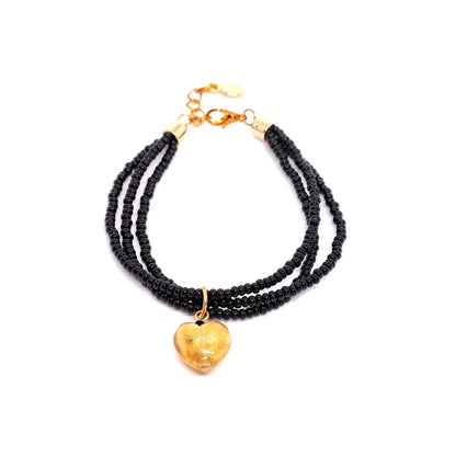 Black and gold parure with multistrand bracelet and earrings in Murano glass.